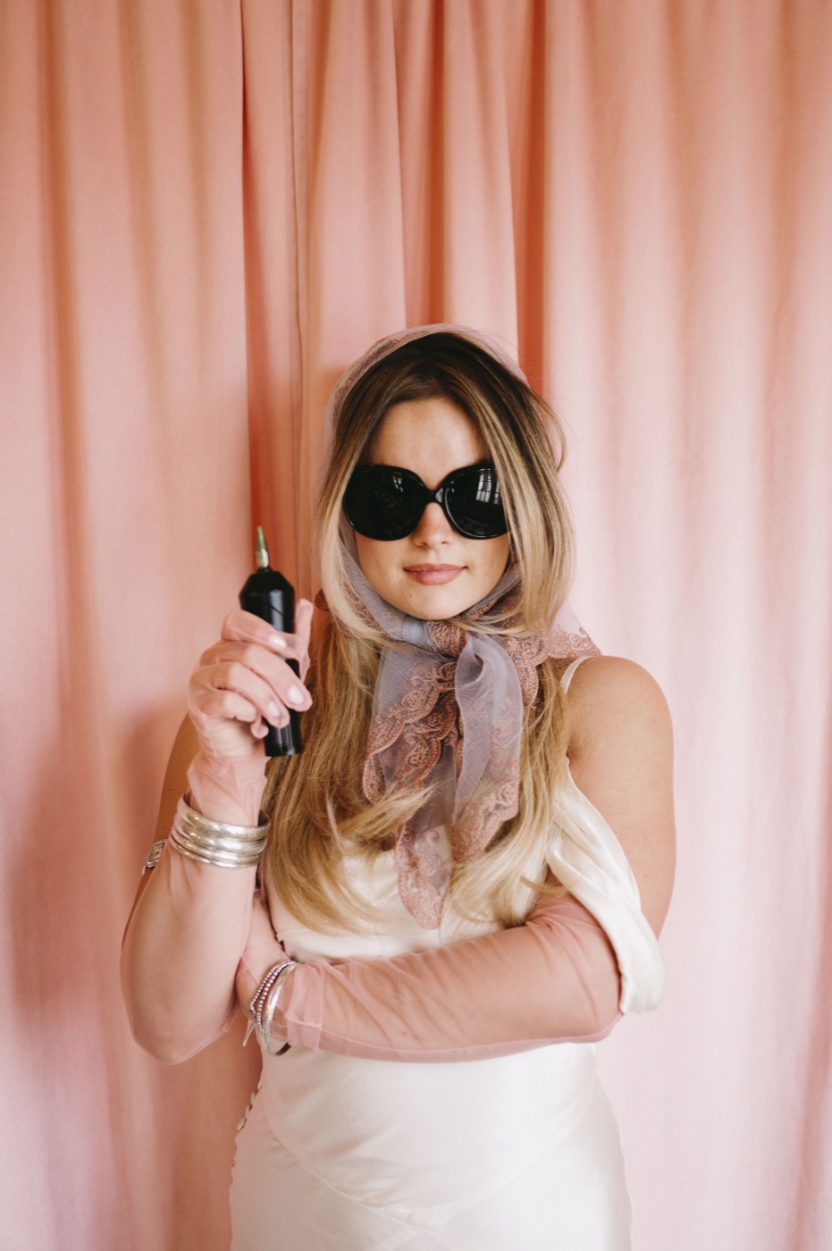 Emilee in sunglasses, machine in hand